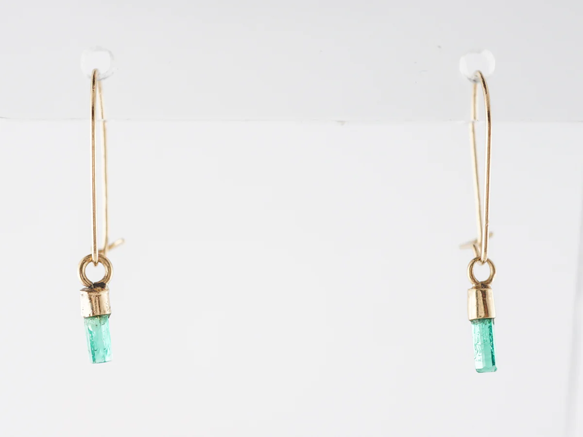 Delicate Emerald Dangle Earrings in 14k Yellow Gold