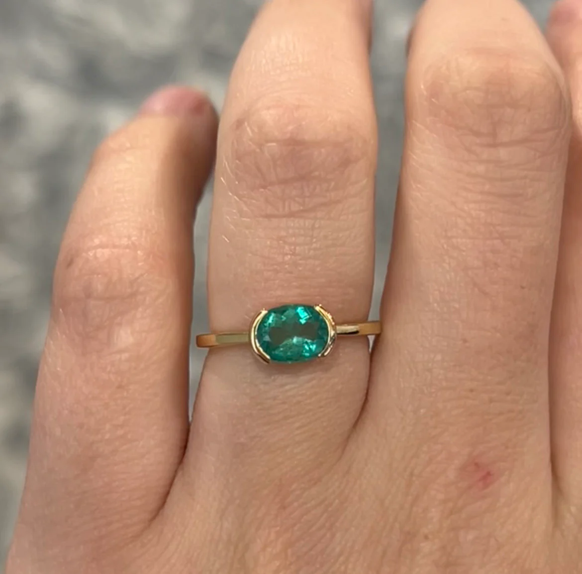 Half Bezel Set Oval Cut Emerald Ring in 14k Yellow Gold - Image 6